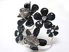 CRYSTAL AND ENAMEL METAL MULTI FLOWER DECO BANGLE