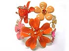CRYSTAL AND ENAMEL METAL MULTI FLOWER DECO BANGLE