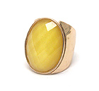 HAMMERED AND CUT OUT METAL AND ON CENTER OVAL FACET CUT GLASS RING