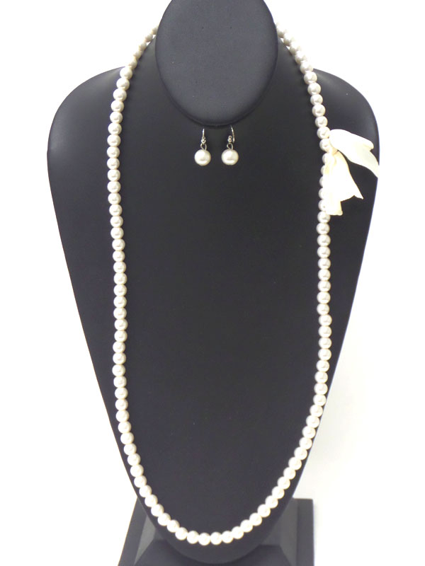 BOW SIDE ACCENT LONG PEARL NECKLACE EARRING SET