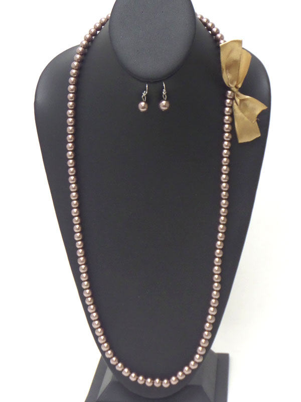 BOW SIDE ACCENT LONG PEARL NECKLACE EARRING SET