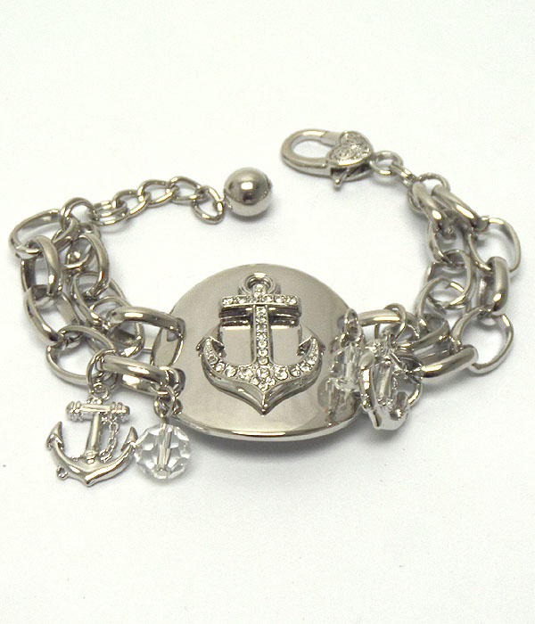 CRYSTAL ANCHOR ON CURVED DISK AND DOUBLE CHAIN BRACELET