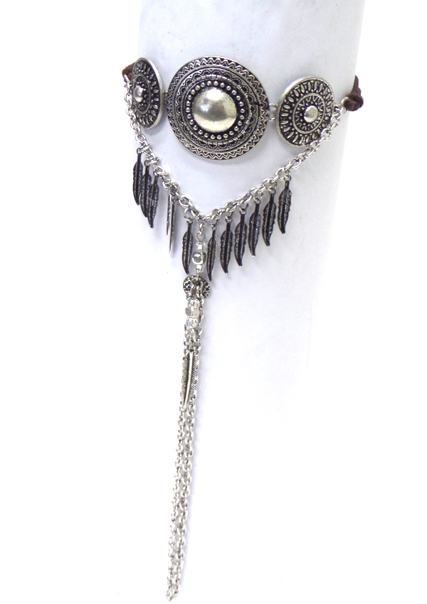 TEXTURED METAL FEATHER AND LONG TASSEL DROP ARM CUFF