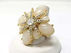 CRYSTAL AND FORMICA STONE LARGE FLOWER STRETCH BAND RING?