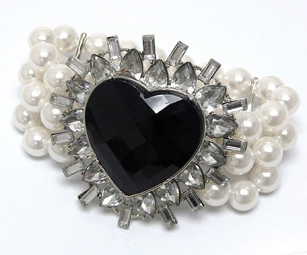 CRYSTAL GLASS HEART WITH TEARDROP GLASS AND THREE ROW PEARL STRETCH BRACELET