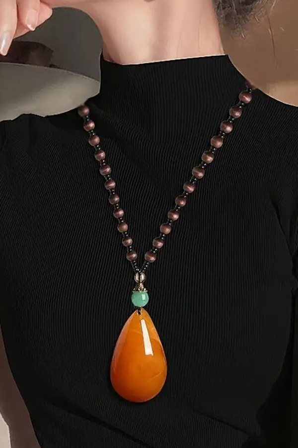 Teardrop resin pendant and wood bead long necklace