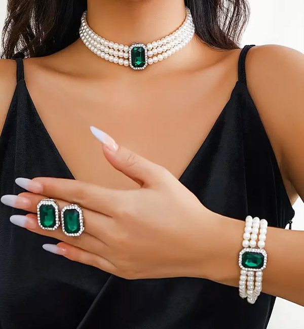 Triple-strand pearl choker with emerald look gemstone set party set