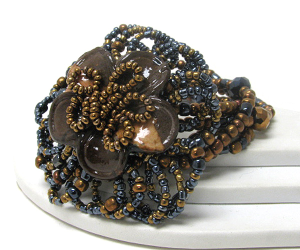 FIGURINE FLOWER AND MULTI BEAD STRETCH BRACELET