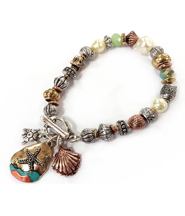 Patina and burnish  tri tone retro vintage strtch bracelet -starfish and shell