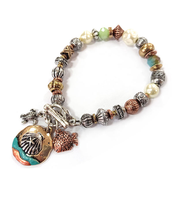 PATINA AND BURNISH  TRI TONE RETRO VINTAGE STRTCH BRACELET -SHELL AND FISH