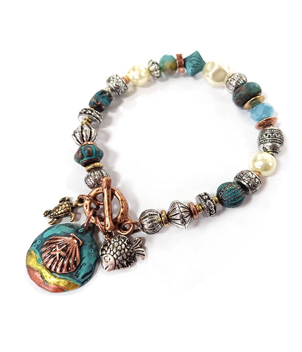 Patina and burnish  tri tone retro vintage strtch bracelet -shell and fish