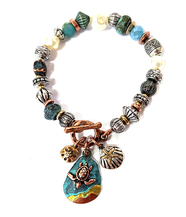 Patina and burnish  tri tone retro vintage strtch bracelet -turtle and starfish