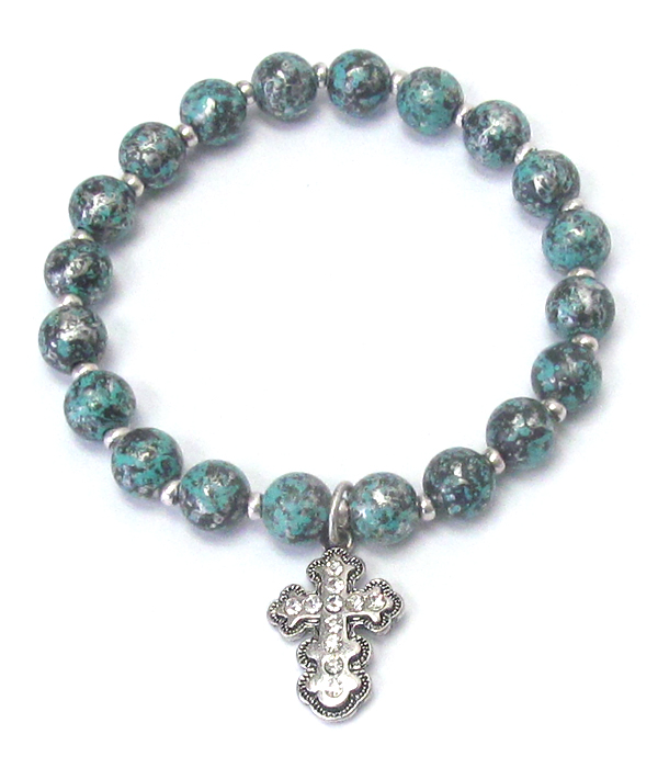 Cross charm and patina ball stretch bracelet