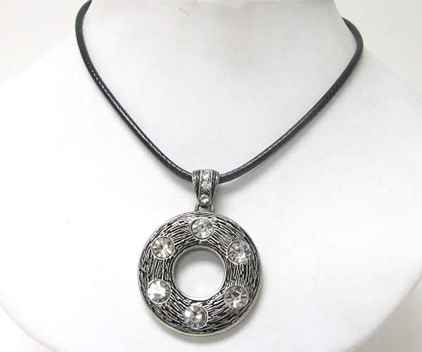 Crystal accent textured metal donut pendant necklace