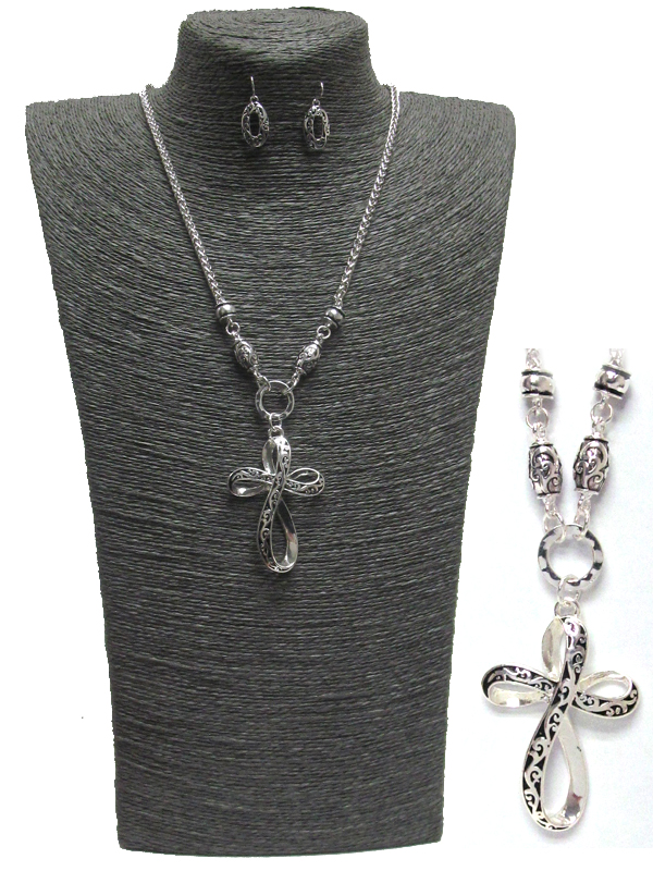 Textured cross necklace and glasses holder