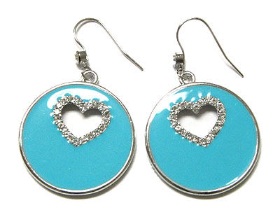 Epoxy circle with punched out heart encircled by crystal earring