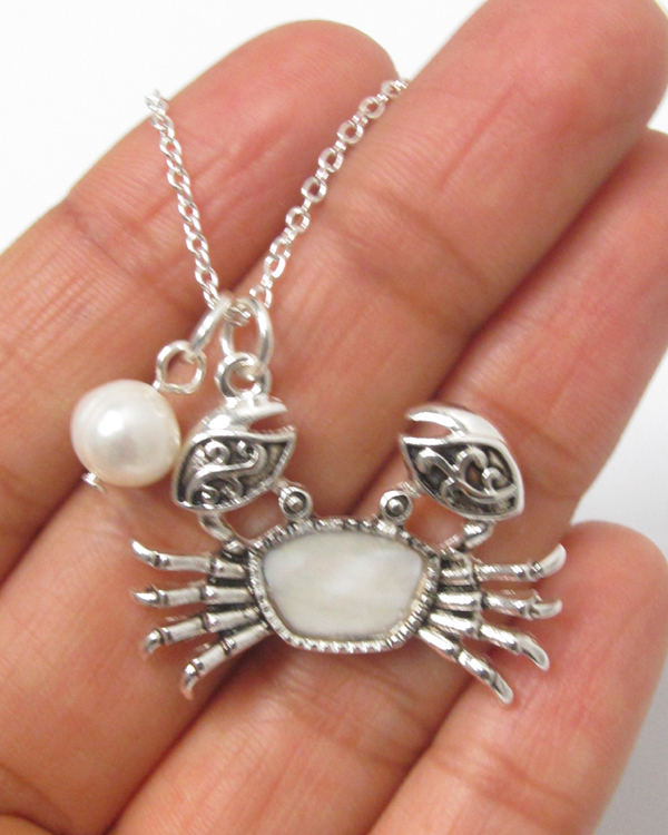 Mother of pearl crab and freshwatr pearl necklace