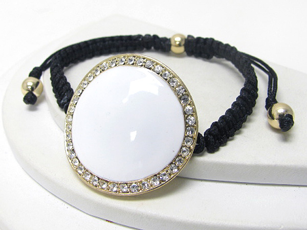 Crystal and epoxy curved disk and twisted cord knot bracelet