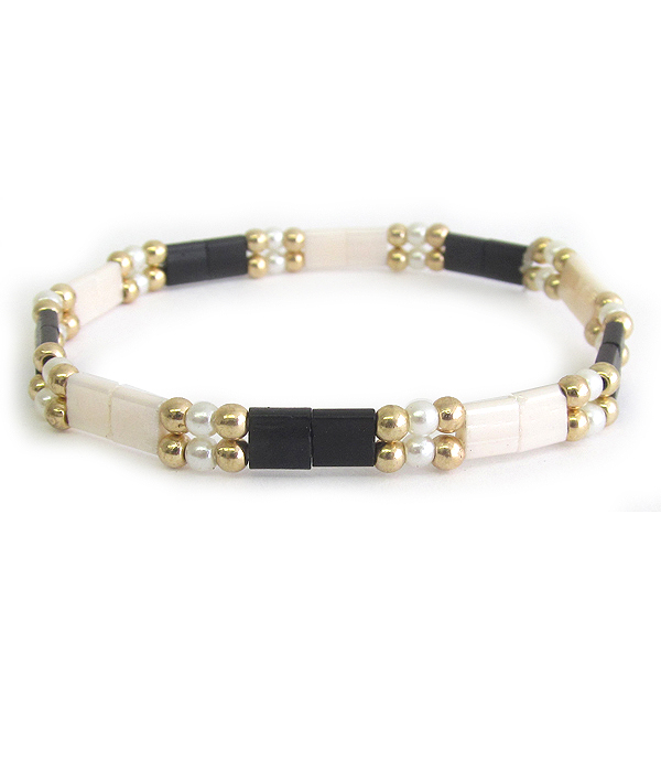 Pearl and flat bead stretch bracelet