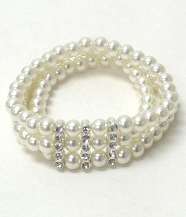 Crystal accent triple pearl stretch bracelet