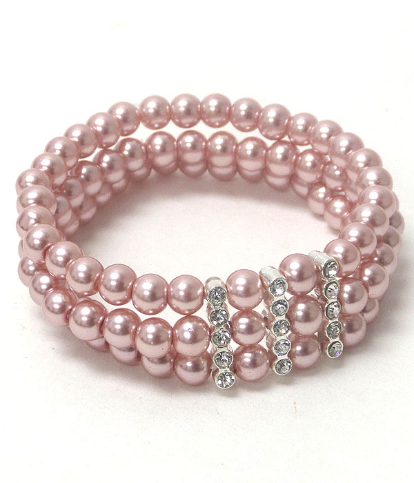 Crystal accent triple pearl stretch bracelet