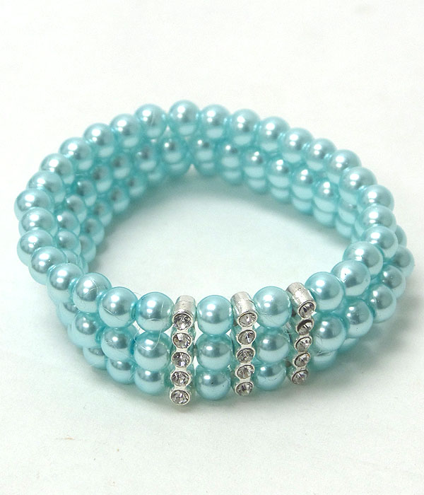 Crystal accent triple pearl stretch bracelet