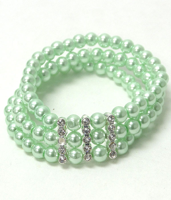 Crystal accent triple pearl stretch bracelet