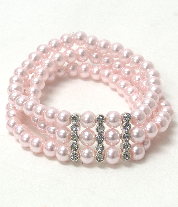 Crystal accent triple pearl stretch bracelet