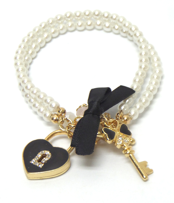 Designer inspired two rows of pearls with charm heart bracelet