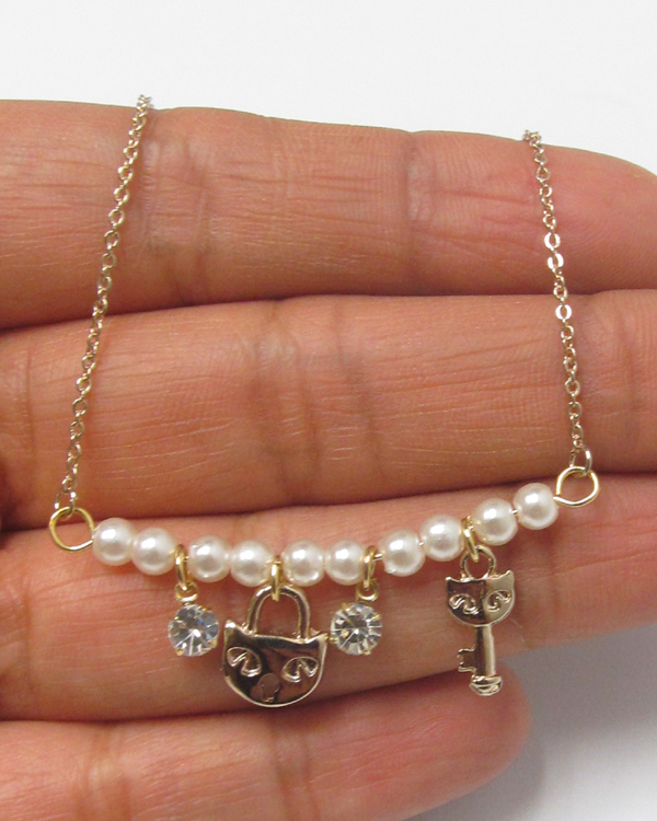 Electro plating and crystal and pearl and key and lock necklace