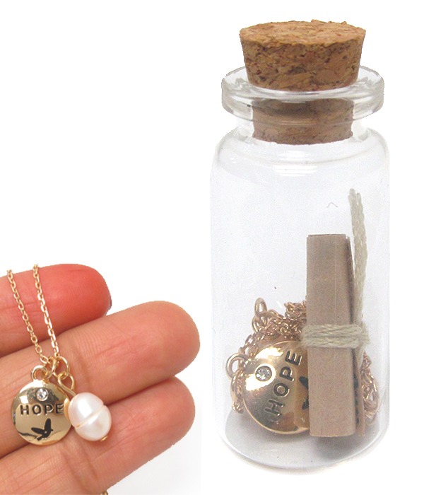Hope necklace and message in glass bottle