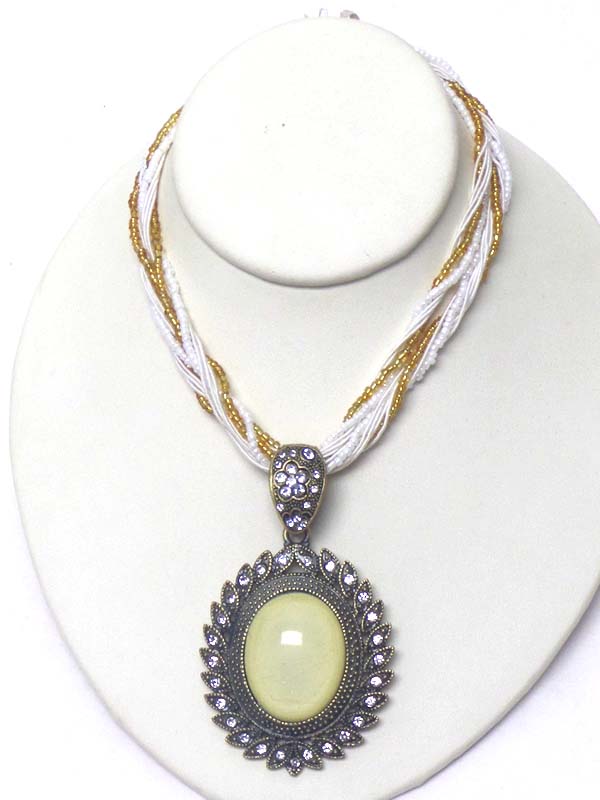 Puffy oval stone and crystal edge pendant and multi seed bead chain mix necklace