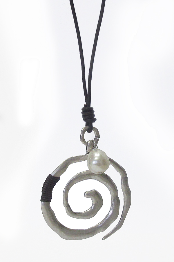Hammered metal swirl pendant and long leather chain necklace