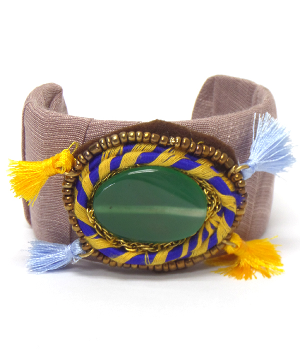 LARGE SEMI PRECIOUS STONE FBRIC WRAPPED WITH TASSEL CUFF BANGLE BRACELET - BRASS