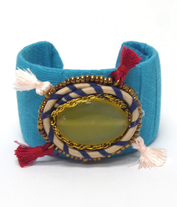 Large semi precious stone fbric wrapped with tassel cuff bangle bracelet - brass