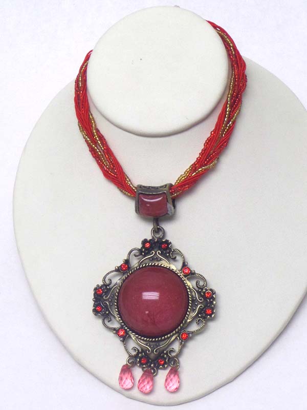 Center puffy stone and metal filigree pendant multi seed bead chain mix necklace