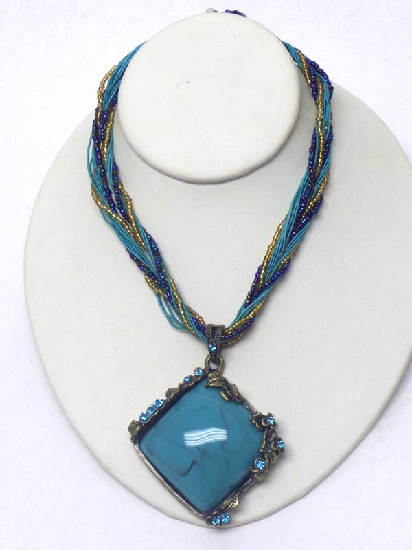 Puffy stone and crystal edge pendant and multi seed bead chain mix necklace