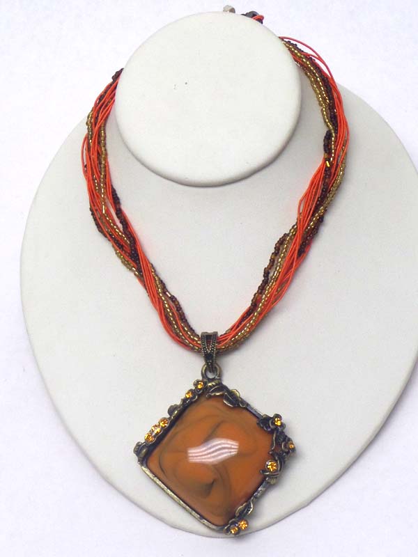 Puffy stone and crystal edge pendant and multi seed bead chain mix necklace