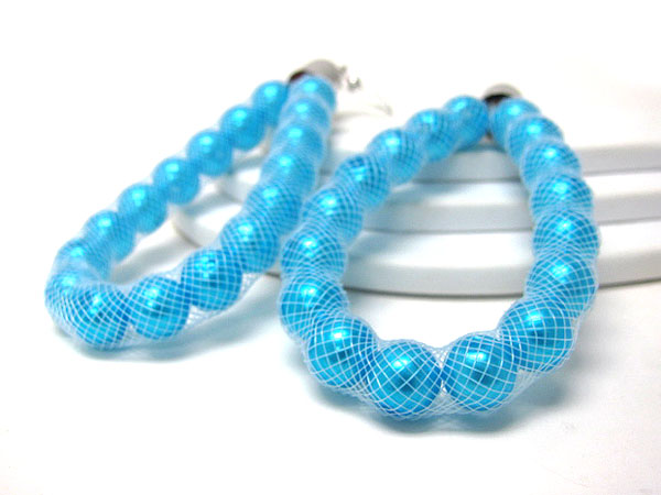 Colored pearl in fabric net tube earrings