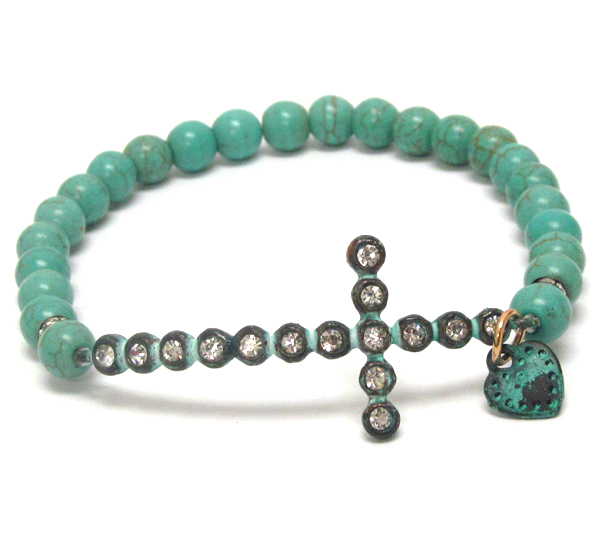 Crystal cross and turquoise ball stretch bracelet