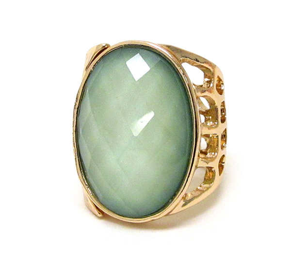 Hammered and cut out metal and on center oval facet cut glass ring