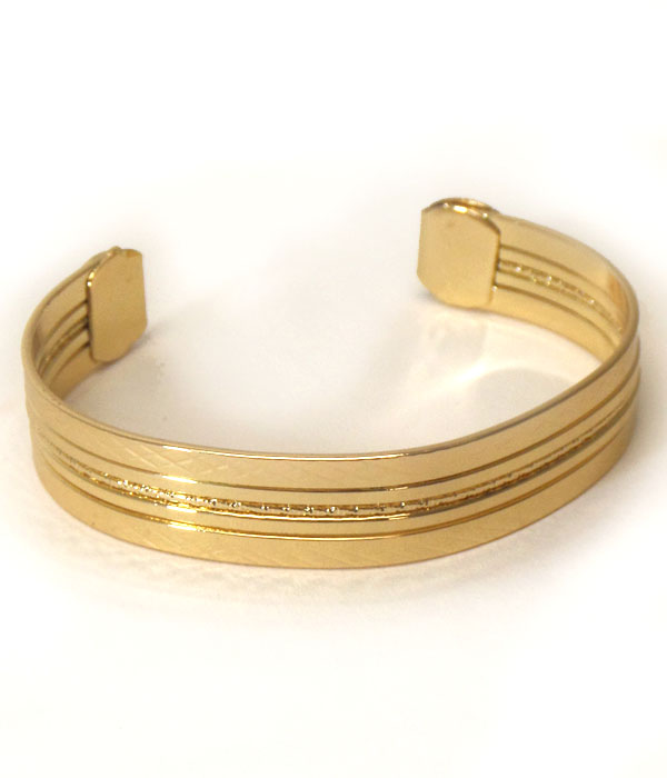 Textured center line metal bangle bracelet