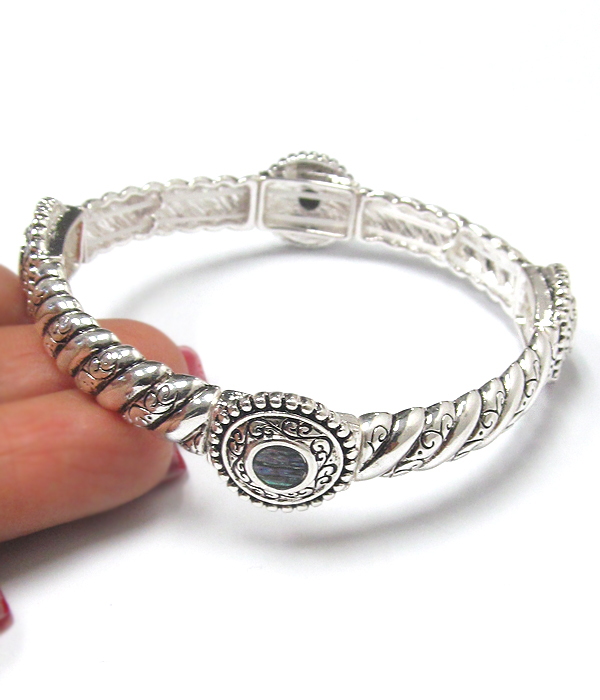 Textured metal and abalone stretch bracelet