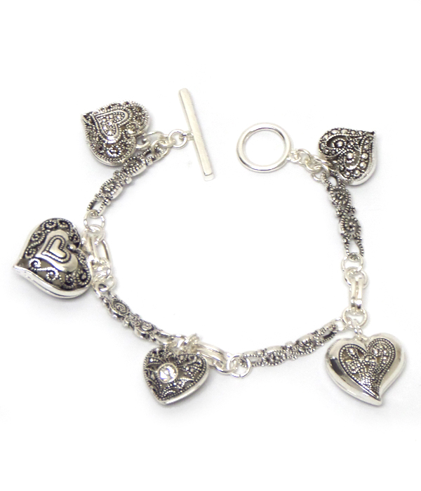 Metal filigree multi puffy heart charm toggle bracelet