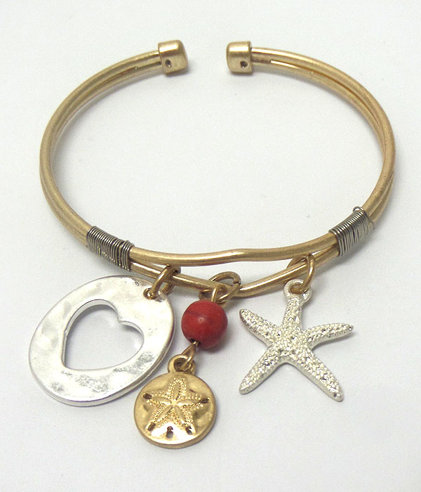 Starfish and hammered heart charm bracelet