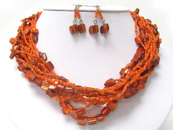Multi strand shell ans seed beads necklace earring set