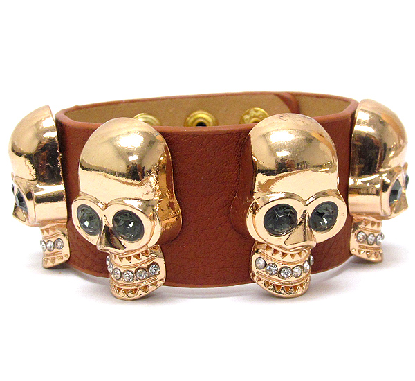 Crystal multi skull and leatherette band bracelet