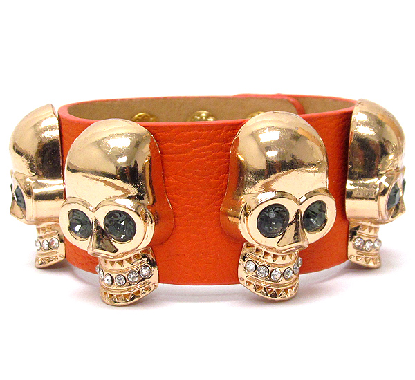 Crystal multi skull and leatherette band bracelet