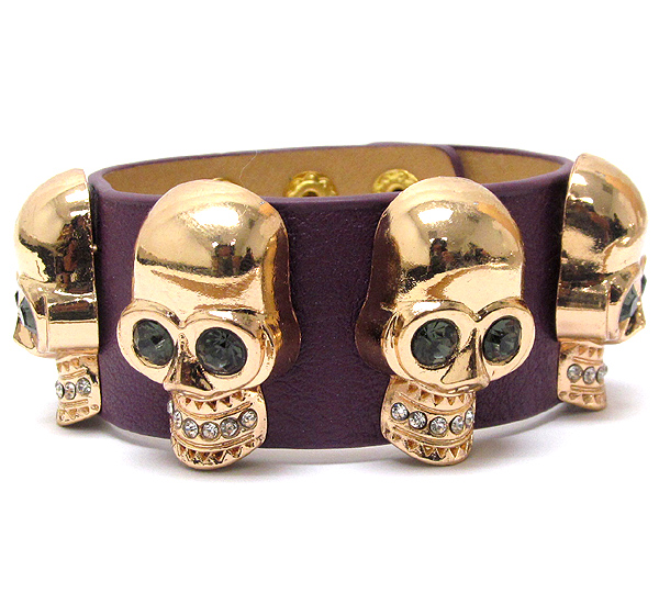 Crystal multi skull and leatherette band bracelet