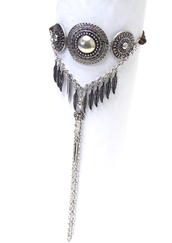 Textured metal feather and long tassel drop arm cuff